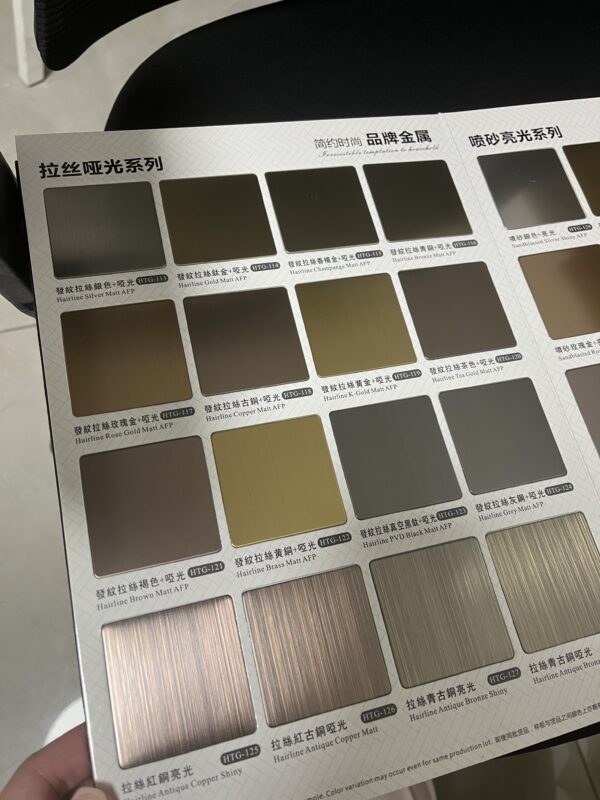 Brushed stainless steel sheet close-up showing fine grain texture and matte finish